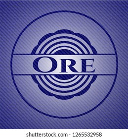 Ore badge with denim background