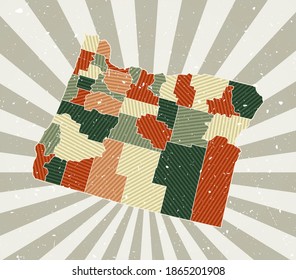 Oregon vintage map. Grunge poster with map of the US state in retro color palette. Shape of Oregon with sunburst rays background. Vector illustration.