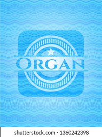 Organ light blue water wave style badge.
