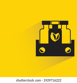 organic beverage bottles with shadow on yellow background
