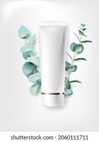 Organic cosmetics for skin care. A jar of cream and a sprig of eucalyptus on a white background.