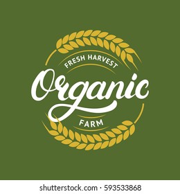 Organic farm hand written lettering logo, label, badge or emblem for natural farm products. Ears of wheat. Isolated on background. Vector illustration.
