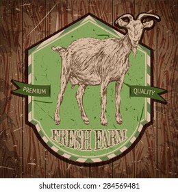 organic farm vintage poster with goat on the background texture of wooden boards. Retro hand drawn vector illustration in sketch style