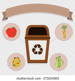Organic food selective collection. Brown trash for the selective collection of remains of organic food. Rotten apple, carrot, orange and cabbage.