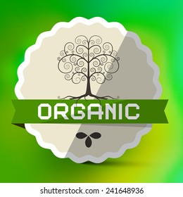 Organic Label with Tree Sign on Green Blurred Bokeh Background