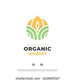 Organic logo. Farmer products emblem. Leaves and sun in a circle.