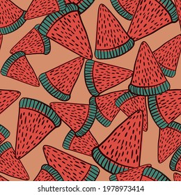 Organic seamless pattern with random red watermelon clise elements. Pink background. Doodle ornament. Graphic design for wrapping paper and fabric textures. Vector Illustration.