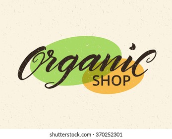 Organic shop label. Logo template for healthy food stores and markets. Hand drawn lettering against recycled paper background. Texture can be easily removed. Eps 10 vector.