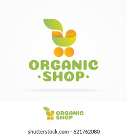 Organic Shop Logo Set Consisting Of Shopping Cart And Leaf Yellow Green Color Isolated On White Background Use For Farm Fresh Shop, Natural Product Market, Vegan Food Store Etc. Vector Illustration