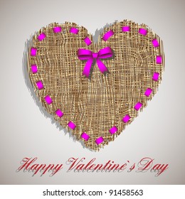 Organic weave heart with pink ribbon.Creative symbol of valentine's day