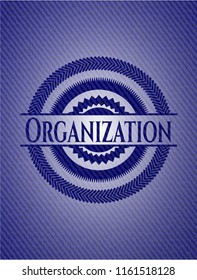 Organization badge with denim background