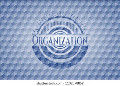 Organization blue badge with geometric pattern.