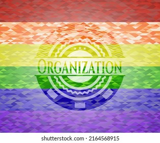 Organization emblem on mosaic background with the colors of the LGBT flag. 