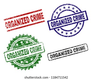 ORGANIZED CRIME seal stamps with corroded surface. Black, green,red,blue vector rubber prints of ORGANIZED CRIME title with grunge surface. Rubber seals with round, rectangle, rosette shapes.