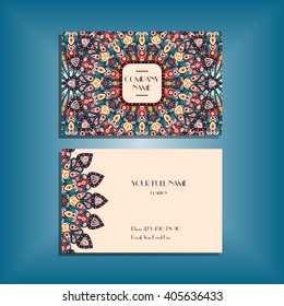 Oriental business card mock-up with red and green round mandala pattern and ornament, floral card design layout template. Size 85mm x 65mm. Front and back sides. Editable and movable objects. EPS 10.