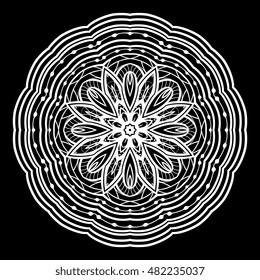Oriental filigree mandala. Round vector design element of white contour on a black background.
