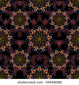 Oriental, floral ornament. Templates for carpets, textiles, wallpaper and any surface. Vector seamless pattern of orange, yellow and violet ornament on a black background.