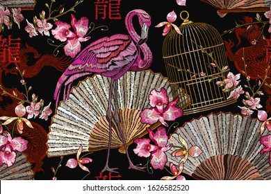 Oriental seamless pattern. Pink flamingo, asian fan, golden cage and sakura flowers. Japanese and Chinese style. East art. Hieroglyph dragon. Fashion japan art. Ethnic template for design of clothes 