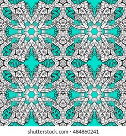 Oriental seamless pattern of white flowers and mandalas. Vector blue background.