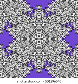 Oriental seamless pattern of white flowers and mandalas. Vector blue background.