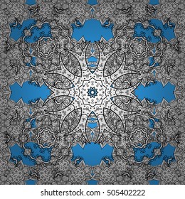 Oriental seamless pattern of white flowers and mandalas. Vector blue background.