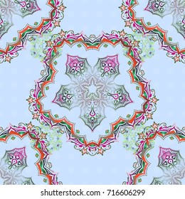 Oriental style arabesques on colored backdrop. Openwork weaving delicate, abstract background. Vector brilliant lace, stylized flowers, paisley. Seamless pattern of pink and green textured curls.