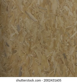 Oriented particle board (OSB wood texture). Lumber pattern. Sheet of plywood with fragments of compressed sawdust. Glued sliver vector seamless background.