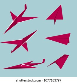 Origami art, red airplane model.The background is blue.