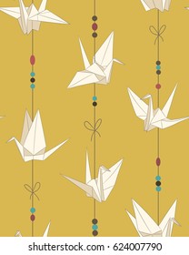 Origami bird figure (paper cranes) seamless vector pattern on yellow background. 