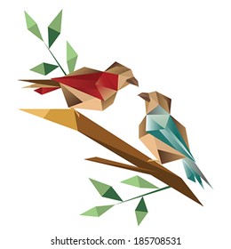 Origami birds sitting on branch