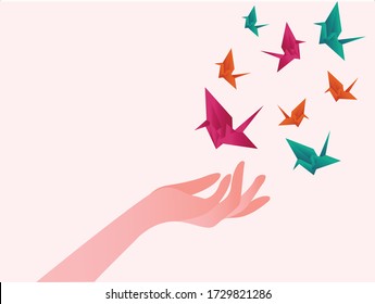 Origami birds vector concept with hands freeing the colorful bird shaped origamis in white background