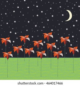 origami flowers in the field , card