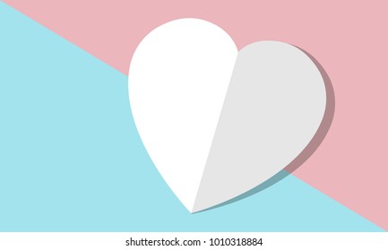 Origami heart shape on blue and red pastel color background. 