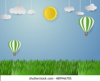 Origami made balloon in sky  on grass shaped. paper art style
