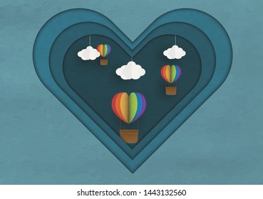 Origami made colorful hot air balloon in a heart with shape hang on sky on blue background .paper art style.