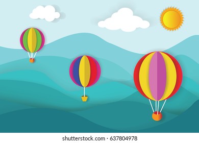 Origami made colorful hot air balloon flying over the top of mountain view.paper art style.