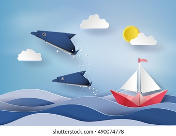 Origami made dolphin and sailing boat floating on sea  .paper art style.