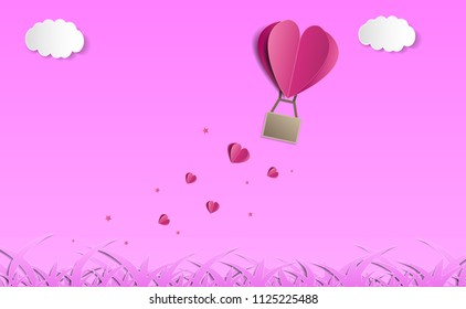 Origami made hot air balloon in a heart shape
