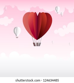Origami made hot air balloon in a heart shape. Cute background for your text for any romantic occasion - Valentine's Day, wedding or anniversary.