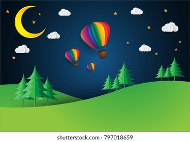 Origami made hot air balloon in a heart shape. paper art style. moon night