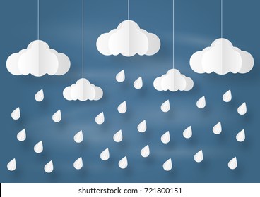 Origami made mobile paper clouds and rain drops on 
navy sky background. paper art design and craft style.