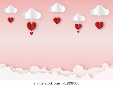Origami made mobile paper of the red hearts with clouds, copy space, paper art design and craft style. Valentine's concept.