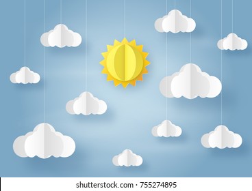 Origami made mobile paper sun and cloud on blue sky background. paper art design and craft style.