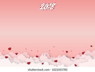 Origami made mobile paper of text " 2018 " from the red heart paper with clouds float in the sky, copy space, paper art design and craft style. Valentine's Day concept.