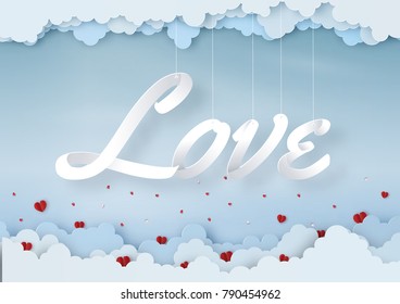 Origami made mobile paper of text " LOVE " with clouds, copy space, paper art design and craft style. Valentine's concept.