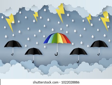 Origami made rainy weather forecast of Water drop on the colorful and black umbrella with thunder in the sky, paper art design and craft style.