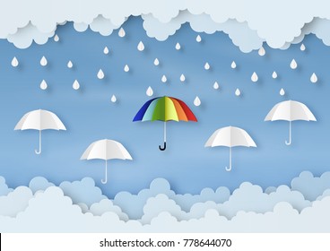 Origami made rainy weather forecast of Water drop on the colorful umbrella, paper art design and craft style.