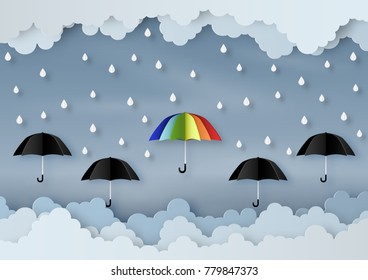 Origami made rainy weather forecast of Water drop on the colorful umbrella and many black umbrella, paper art design and craft style.