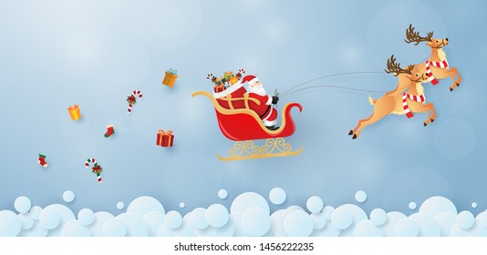 Origami paper art of Santa Claus and reindeer flying on the sky, Merry Christmas and Happy New Year