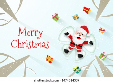 Origami paper art of Santa Claus laying on the snow to make a snow angel, Merry Christmas and Happy New Year
